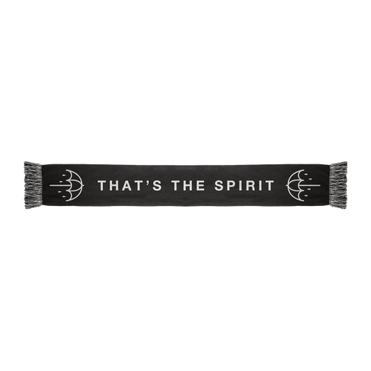 Black frill scarf featuring white “THAT’S THE SPIRIT” text across the middle and white umbrella prints on each side.