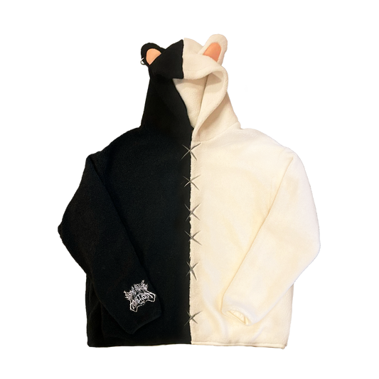Black and white unisex hooded fleece with a split design—right side black, left side white. The hood has a pair of ears, and the right sleeve cuff features white 'Horizon' embroidery.